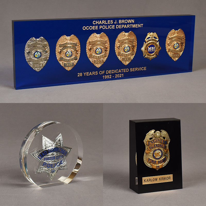 Three different Police Badge Lucite® Embedments with engraved text and different configurations.